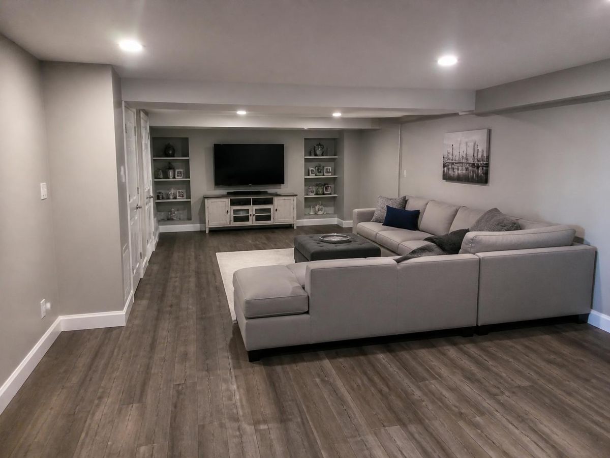 Luxury vinyl plank flooring in a finished basement